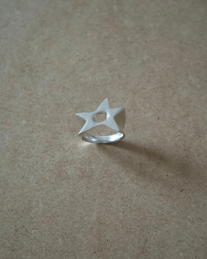 Front view of handmade sterling silver Aster Ring showing the cut-out star face