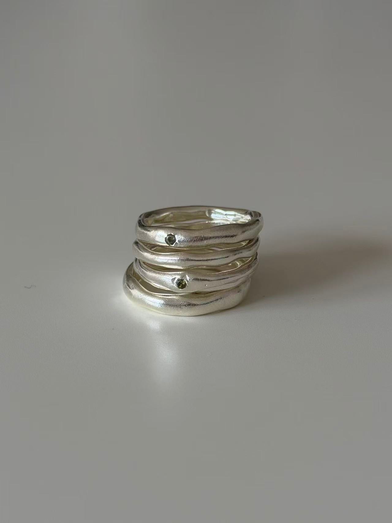 Detail view of the hand-carved sterling silver band